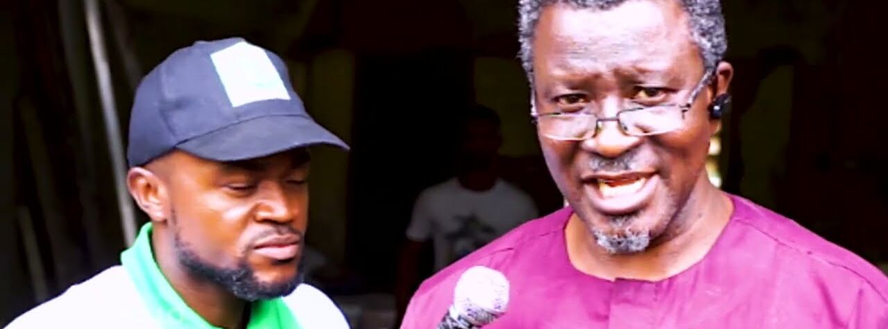 A Lashone TV reporter interviewing a speaker with a microphone